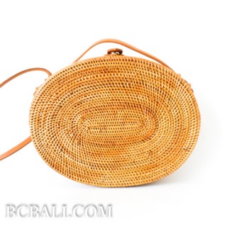 Oval rattan handbag ata hand woven leather handle 